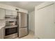 Updated kitchen featuring stainless steel appliances and bright white cabinetry at 2020 Douglas Ave, Dunedin, FL 34698