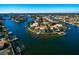 Waterfront property with a pool and dock on a sunny day showcasing the expansive canal views at 2096 Massachusetts Ne Ave, St Petersburg, FL 33703