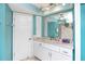 Well-lit bathroom with granite countertop, ample storage and modern fixtures at 2096 Massachusetts Ne Ave, St Petersburg, FL 33703