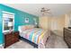 Comfortable bedroom features colorful decor, ceiling fan, and en-suite access at 2096 Massachusetts Ne Ave, St Petersburg, FL 33703