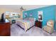 Bright bedroom with colorful decor, comfortable bed, and ample natural light at 2096 Massachusetts Ne Ave, St Petersburg, FL 33703