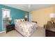 Bright bedroom featuring colorful walls, a comfortable queen-sized bed, and ample natural light at 2096 Massachusetts Ne Ave, St Petersburg, FL 33703