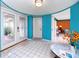 Bright foyer with tile flooring, white doors and colorful walls leading into the open living spaces at 2096 Massachusetts Ne Ave, St Petersburg, FL 33703