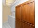 Convenient laundry room featuring a washer, dryer, utility sink, and added cabinet storage at 2096 Massachusetts Ne Ave, St Petersburg, FL 33703