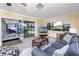 Cozy living room features large windows, neutral color palette and comfortable seating at 2096 Massachusetts Ne Ave, St Petersburg, FL 33703