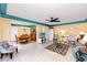 Open-concept living area featuring tile floors, dining area, and comfortable seating with lots of natural light at 2096 Massachusetts Ne Ave, St Petersburg, FL 33703