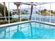 Inviting screened pool with sparkling water and views of the waterway at 2096 Massachusetts Ne Ave, St Petersburg, FL 33703