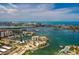 Wide aerial showing a picturesque waterfront community with various property types, boat docks and beautiful water views at 222 Skiff Pt, Clearwater, FL 33767