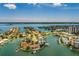 Wide aerial shot of waterfront homes with docks, offering stunning views, and a tranquil residential neighborhood at 222 Skiff Pt, Clearwater, FL 33767
