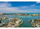 Beautiful aerial view of a waterfront home featuring boat docks, surrounded by lush greenery and coastal waterways at 222 Skiff Pt, Clearwater, FL 33767