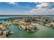 Stunning aerial view highlighting a waterfront home featuring private boat docks and a peaceful, luxurious residential setting at 222 Skiff Pt, Clearwater, FL 33767