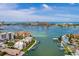 Expansive aerial view showcasing waterfront property, boats, and the city skyline in the distance at 222 Skiff Pt, Clearwater, FL 33767