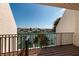 Balcony view overlooking the water, boats, and lush tropical landscaping at 222 Skiff Pt, Clearwater, FL 33767