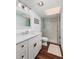 Bright bathroom with modern vanity and glass-enclosed shower at 222 Skiff Pt, Clearwater, FL 33767