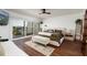 Bedroom with water views, a comfortable bed, bench seating, and a ceiling fan at 222 Skiff Pt, Clearwater, FL 33767