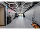 Spacious garage featuring epoxy floors, a creative lighting design and ample storage at 222 Skiff Pt, Clearwater, FL 33767