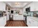 Bright and open kitchen with stainless steel appliances and open shelving to the left of the image at 222 Skiff Pt, Clearwater, FL 33767