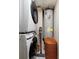 Laundry closet with stacked washer and dryer and water heater at 222 Skiff Pt, Clearwater, FL 33767