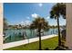 Scenic water views with palm trees from the property, creating a tranquil waterfront living experience at 222 Skiff Pt, Clearwater, FL 33767