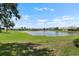 The backyard provides serene views of the pond and surrounding greenery at 2490 Kensington Greens Dr # 0, Sun City Center, FL 33573