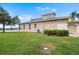 The house features a well-maintained lawn with mature hedges, and an attached two car garage at 2490 Kensington Greens Dr # 0, Sun City Center, FL 33573