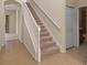 Foyer featuring tile floors and a staircase leading to the upper level at 2490 Kensington Greens Dr # 0, Sun City Center, FL 33573