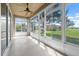 The spacious lanai offers views of the green yard and the lake at 2490 Kensington Greens Dr # 0, Sun City Center, FL 33573