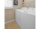 Practical laundry room with modern washer and dryer at 2490 Kensington Greens Dr # 0, Sun City Center, FL 33573