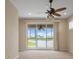 Living room with lake views and a ceiling fan at 2490 Kensington Greens Dr # 0, Sun City Center, FL 33573