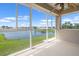 Expansive screened-in patio with serene lake views and ample natural light at 2490 Kensington Greens Dr # 0, Sun City Center, FL 33573