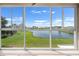 Scenic view of the pond, and the surrounding green landscape at 2490 Kensington Greens Dr # 0, Sun City Center, FL 33573