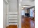 Open hallway with hardwood floors leads into the main living area with a view of the fireplace at 302 W Curtis St, Tampa, FL 33603