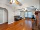 Inviting living room features hardwood floors, ceiling fan, and a cozy brick fireplace at 302 W Curtis St, Tampa, FL 33603
