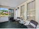 Cozy porch with seating, a table, and view of the neighborhood at 302 W Curtis St, Tampa, FL 33603