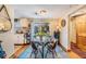 Charming dining area with glass table, adjacent to the outdoor space at 3035 Hillview St, Sarasota, FL 34239