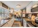 Updated kitchen boasts granite countertops, stainless appliances, and an open layout to the adjacent dining area at 3035 Hillview St, Sarasota, FL 34239