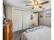This cozy main bedroom features a ceiling fan, a large closet, and access to another room at 3035 Hillview St, Sarasota, FL 34239