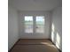 Bedroom featuring carpet and windows at 316 Vistera Blvd, Nokomis, FL 34275