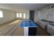 Open-concept living room and kitchen area showing lots of natural light and space at 316 Vistera Blvd, Nokomis, FL 34275