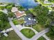Lovely aerial shot of home and lake, lush green lawns at 3724 Fawn Grove Ct, Land O Lakes, FL 34639