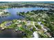 Lake community with waterfront houses and mature trees at 3724 Fawn Grove Ct, Land O Lakes, FL 34639