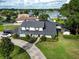Overhead view of home showcasing manicured landscaping, and proximity to a lake at 3724 Fawn Grove Ct, Land O Lakes, FL 34639