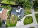Gorgeous aerial view of home with pool, boat lift, and lake access at 3724 Fawn Grove Ct, Land O Lakes, FL 34639