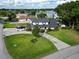 Beautiful aerial view of a home with manicured lawns and mature landscaping at 3724 Fawn Grove Ct, Land O Lakes, FL 34639