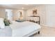 Neutral bedroom featuring white walls, beige carpeting, and a view into the ensuite at 3724 Fawn Grove Ct, Land O Lakes, FL 34639