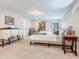 Cozy bedroom featuring carpet and soft lighting, creating a relaxing retreat at 3724 Fawn Grove Ct, Land O Lakes, FL 34639