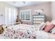 Charming bedroom showcasing a stylish bed, complemented by carpeted floors and shuttered windows at 3724 Fawn Grove Ct, Land O Lakes, FL 34639
