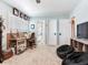 Bright room featuring neutral toned walls, carpeted floors and a view into the bathroom and closets at 3724 Fawn Grove Ct, Land O Lakes, FL 34639