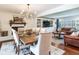 Bright dining area showcasing a fireplace and seamlessly integrated living spaces at 3724 Fawn Grove Ct, Land O Lakes, FL 34639