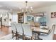 Open dining area with wood table and backyard views, perfect for Gathering meals at 3724 Fawn Grove Ct, Land O Lakes, FL 34639